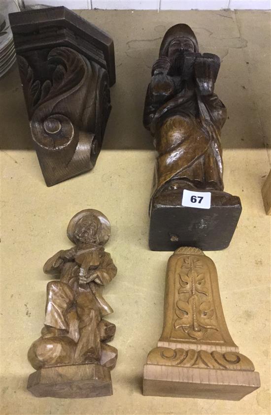 2 carved wood figures with brackets